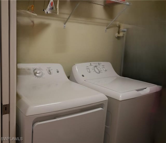 laundry area with washing machine and dryer