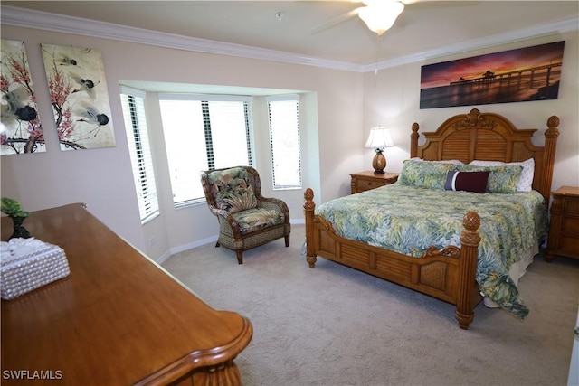 bedroom with ceiling fan, crown molding, baseboards, and light carpet