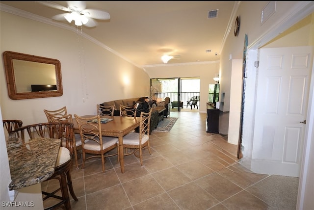 dining area with ornamental molding, visible vents, ceiling fan, and light tile patterned floors