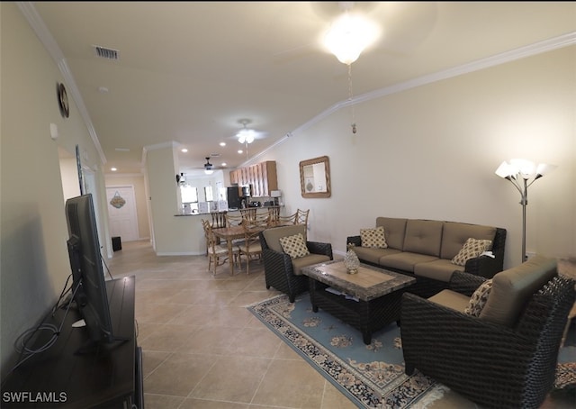 living room with light tile patterned floors, visible vents, crown molding, and a ceiling fan