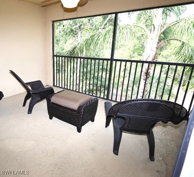 balcony featuring a ceiling fan