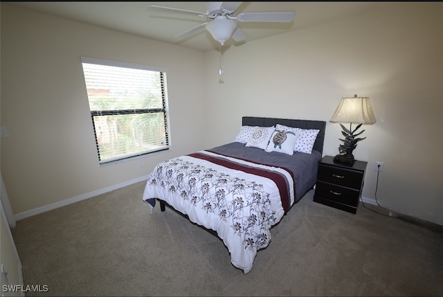 carpeted bedroom featuring ceiling fan and baseboards