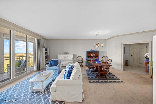 living room featuring carpet flooring, crown molding, and a chandelier