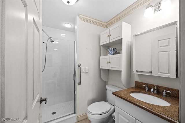 bathroom with ornamental molding, toilet, walk in shower, and vanity