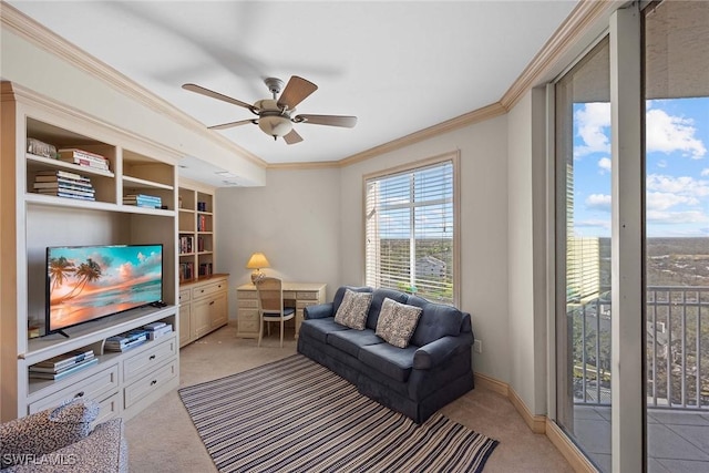 carpeted living room featuring ceiling fan and ornamental molding