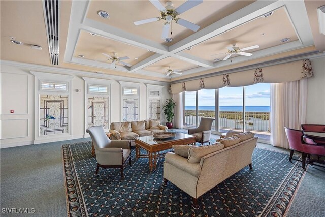 sunroom / solarium with ceiling fan, beamed ceiling, a water view, and coffered ceiling