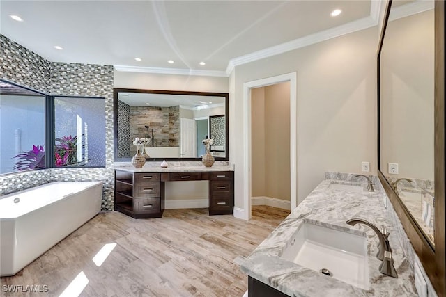 bathroom featuring hardwood / wood-style flooring, vanity, separate shower and tub, and crown molding