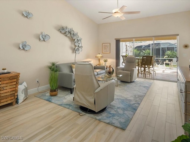 living room featuring light hardwood / wood-style floors and ceiling fan