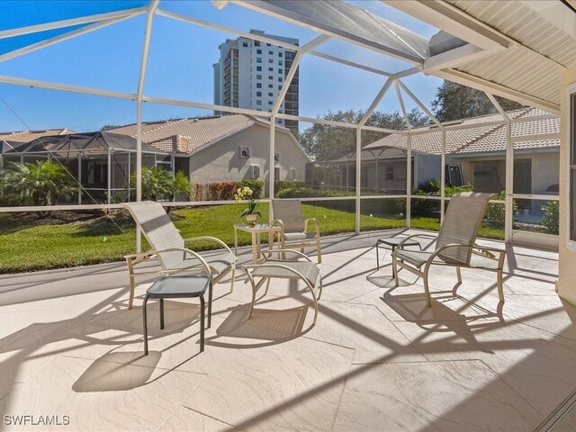 view of patio / terrace featuring glass enclosure