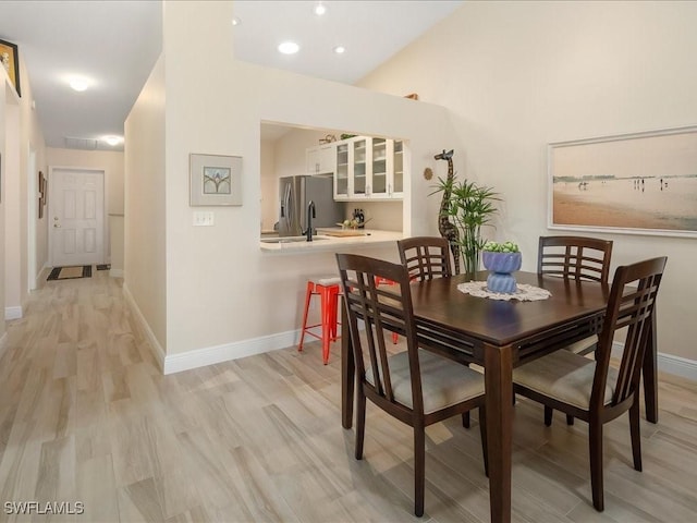 dining area with light wood-type flooring