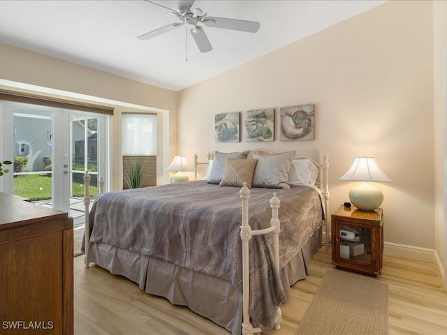 bedroom with access to exterior, french doors, light wood-type flooring, and ceiling fan