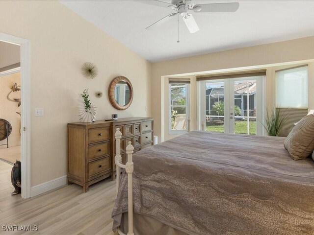 bedroom with ceiling fan, french doors, and light hardwood / wood-style flooring