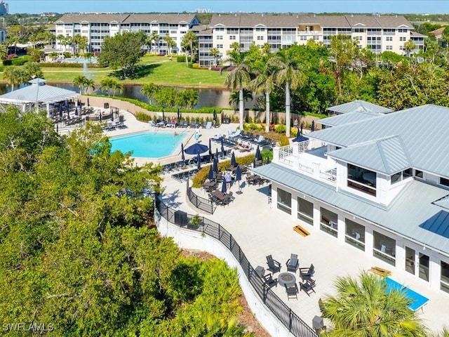 birds eye view of property with a water view