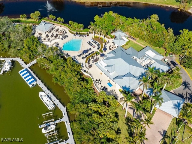 birds eye view of property with a water view