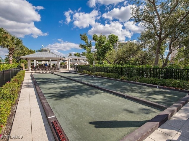 view of property's community featuring fence and a gazebo