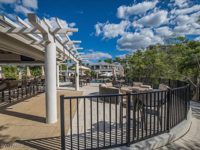 view of patio / terrace with a pergola and outdoor dining space