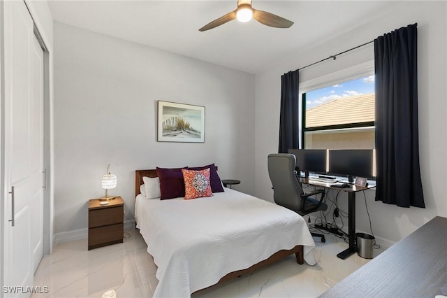 bedroom featuring ceiling fan and a closet