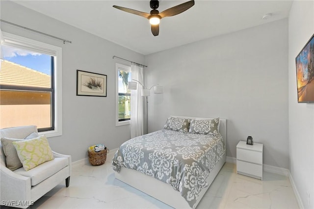 bedroom featuring ceiling fan and multiple windows