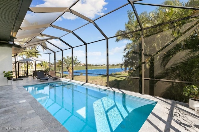 view of swimming pool featuring a patio, a water view, and glass enclosure