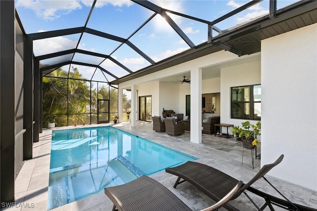 view of swimming pool featuring outdoor lounge area, a patio, ceiling fan, and a lanai