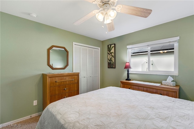 carpeted bedroom featuring ceiling fan and a closet