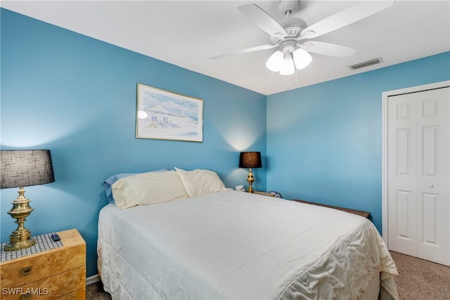 bedroom featuring a closet, ceiling fan, and carpet flooring