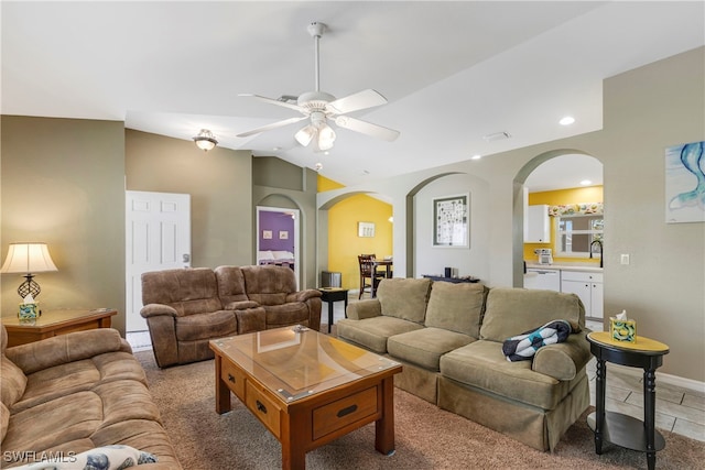 living room with vaulted ceiling, sink, and ceiling fan