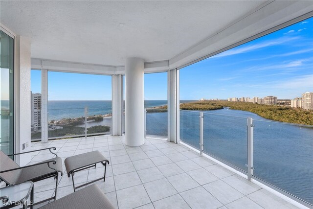 balcony featuring a water view