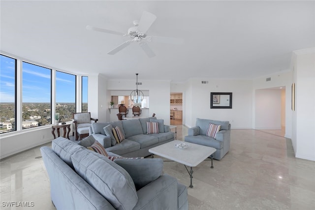 living room featuring visible vents, baseboards, and ceiling fan with notable chandelier