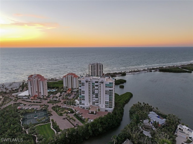 aerial view at dusk with a water view