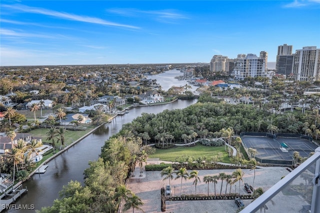 drone / aerial view featuring a view of city and a water view