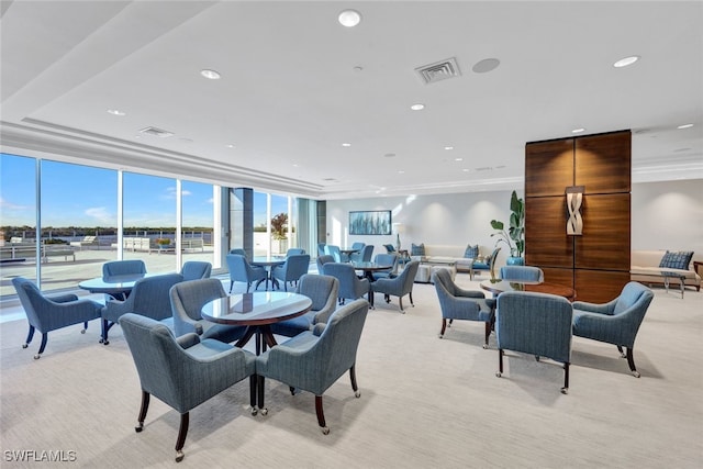 carpeted dining room with floor to ceiling windows