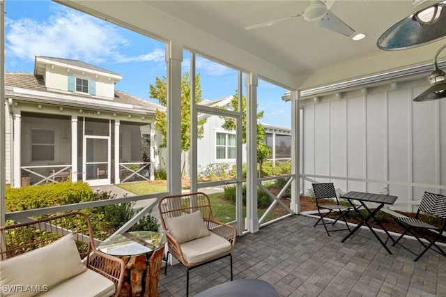 sunroom / solarium with ceiling fan