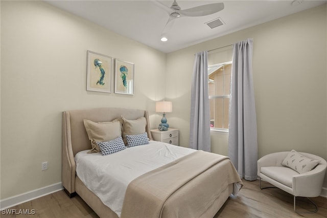 bedroom featuring ceiling fan and light hardwood / wood-style floors