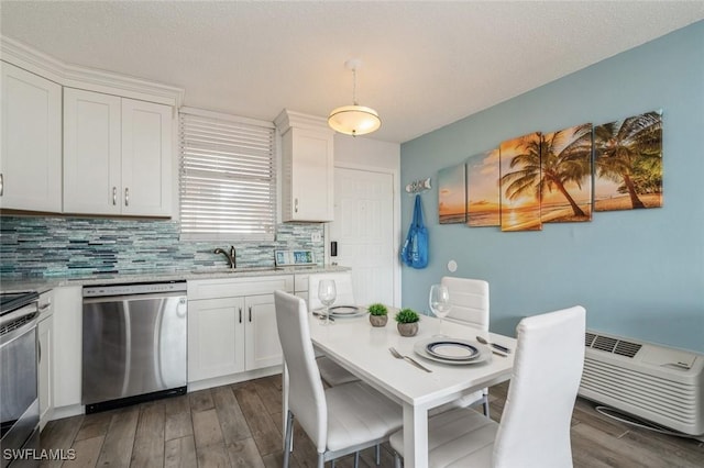 5600 Bonita Beach Rd Unit 508, Bonita Springs, FL 34134 - kitchen with stove, dishwasher, a sink, white cabinetry, and dark wood-type flooring
