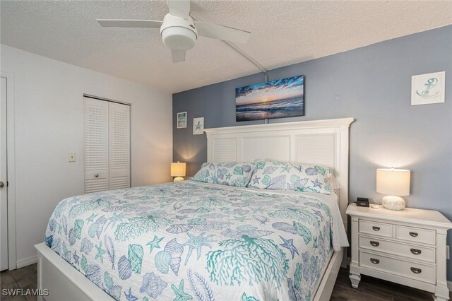 5600 Bonita Beach Rd Unit 508, Bonita Springs, FL 34134 - bedroom featuring ceiling fan, a textured ceiling, baseboards, a closet, and dark wood-type flooring