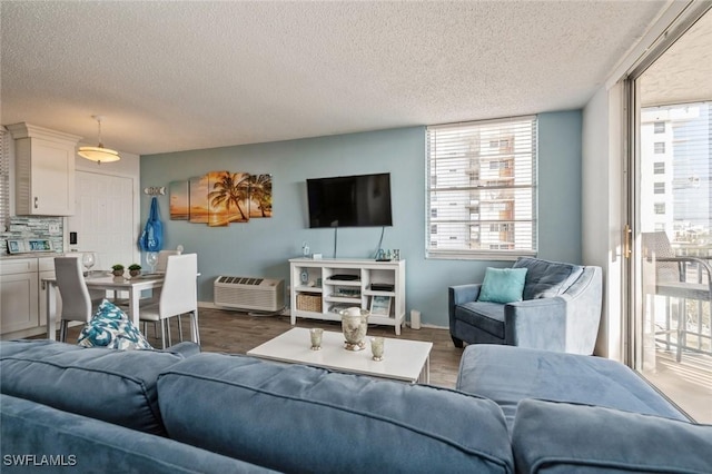 5600 Bonita Beach Rd Unit 508, Bonita Springs, FL 34134 - living room featuring a textured ceiling and wood finished floors