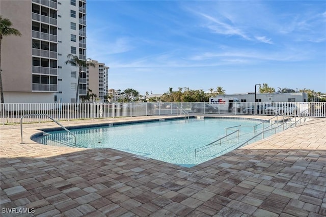 view of swimming pool with a patio area