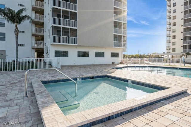 5600 Bonita Beach Rd Unit 508, Bonita Springs, FL 34134 - community pool featuring a patio and fence