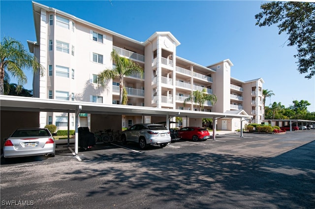 view of property featuring covered parking