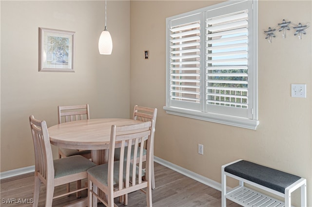 dining area with light hardwood / wood-style flooring