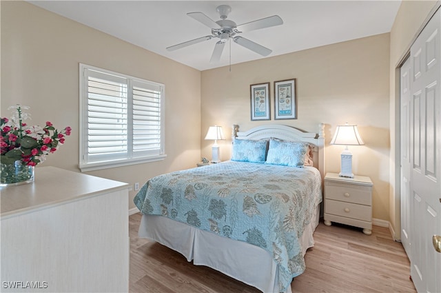 bedroom with ceiling fan, a closet, and light hardwood / wood-style floors