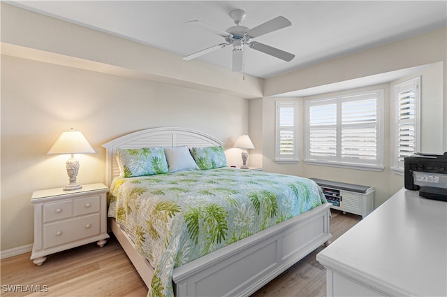 bedroom featuring hardwood / wood-style floors and ceiling fan