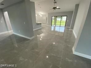 unfurnished living room featuring ceiling fan