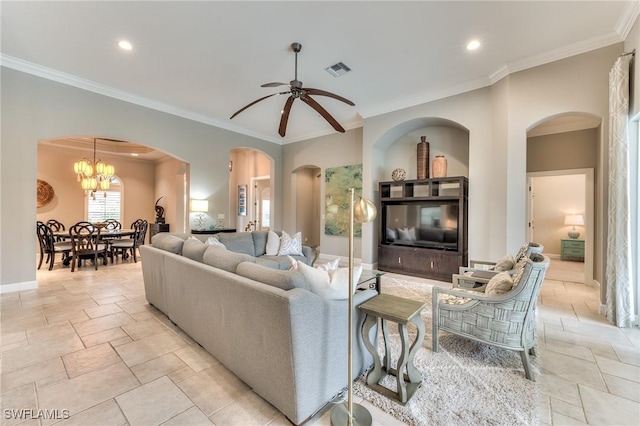 living room featuring ornamental molding and ceiling fan with notable chandelier