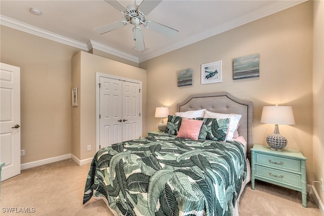 carpeted bedroom featuring a closet, ceiling fan, and ornamental molding