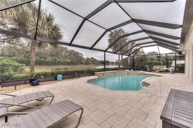 view of swimming pool featuring a lanai and a patio