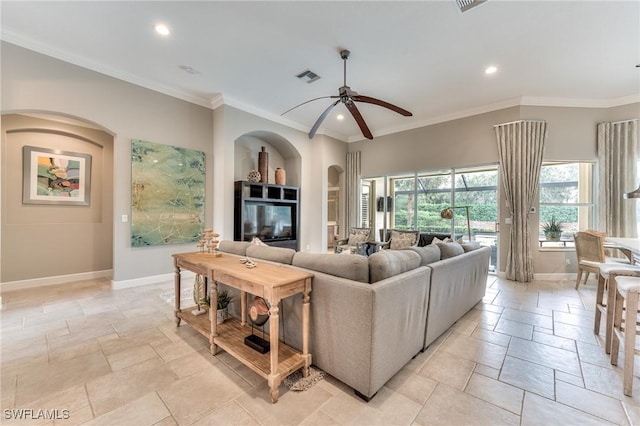 living room with ceiling fan, ornamental molding, and built in features