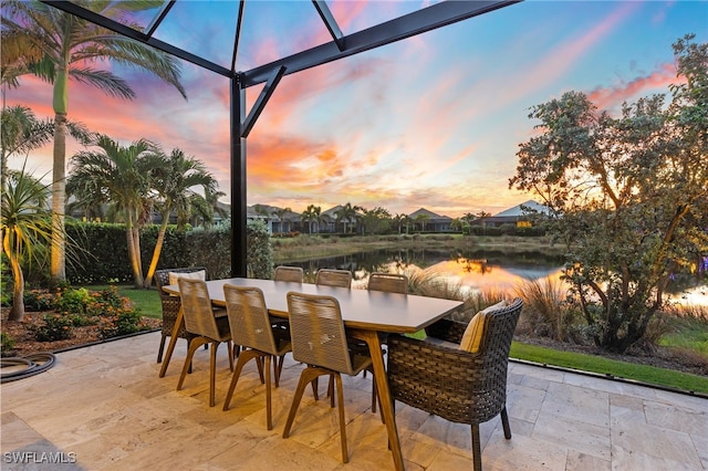 patio terrace at dusk with a water view