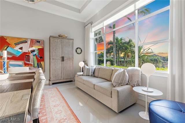 interior space with light tile patterned flooring, crown molding, and plenty of natural light